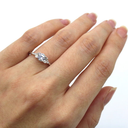 Round Solitaire With Baguette & Round Shoulders Engagement Ring